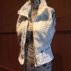 White vest with leatherette accent on the waist.